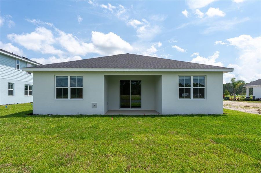 Exterior details and patio area of a home in The Palms at Venetian Bay, New Smyrna Beach (Image 15).