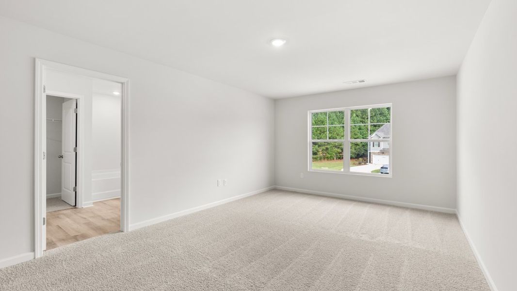 Representative unfurnished interior of a home built from the Salisbury by D.R. Horton in Waypoint, Flowery Branch (Image 21).