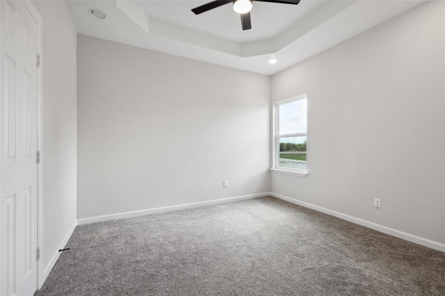 Unfurnished bedroom with carpet, baseboards, recessed lighting, and a ceiling fan Unfurnished bedroom with carpet, baseboards, recessed lighting, and a ceiling fan