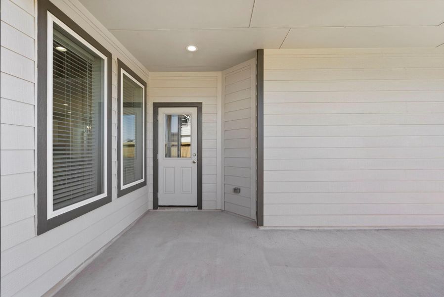 Exterior details and patio area of a home in Grand Oaks Village, Houston (Image 4).