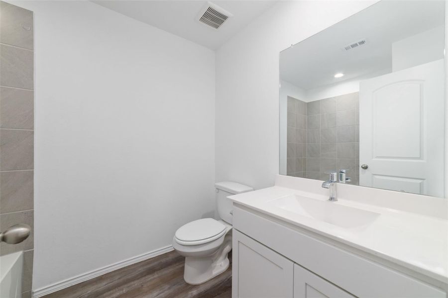 Furnished interior view inside a new home in Sunterra, Katy (Image 11).