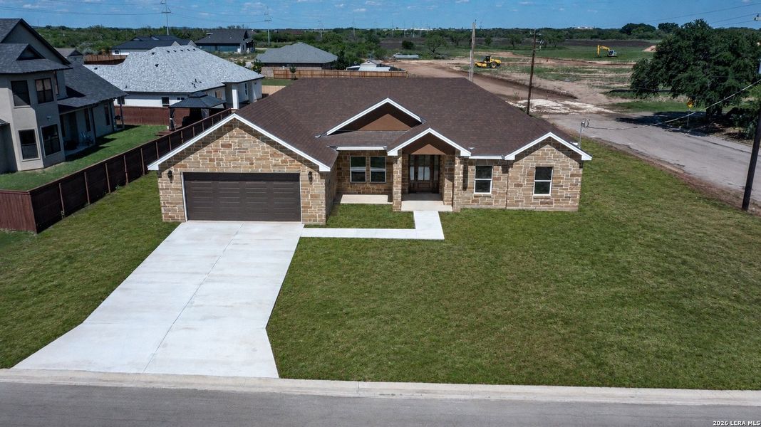Front exterior of a new home in , Uvalde, TX, highlighting curb appeal (Image 2).