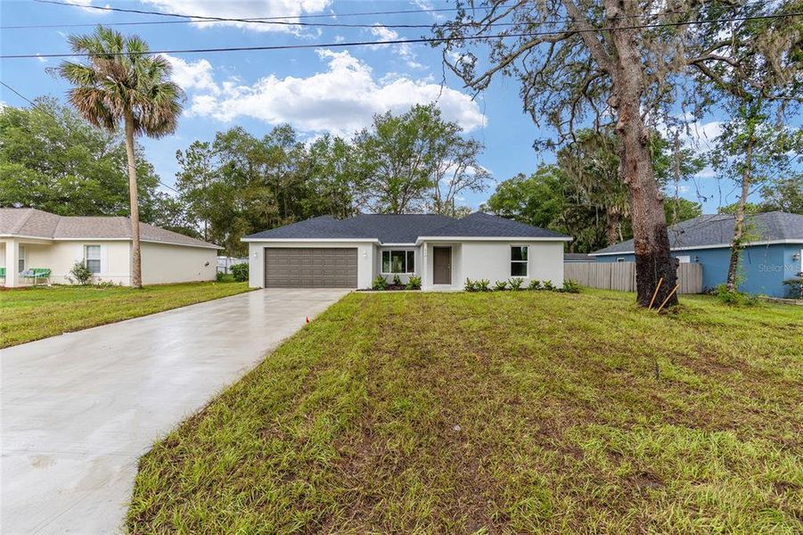 Front exterior of a new home in , Ocala, FL, highlighting curb appeal (Image 27).