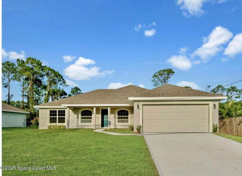 Front exterior of a new home in Palm Bay, Palm Bay, FL, highlighting curb appeal (Image 1).