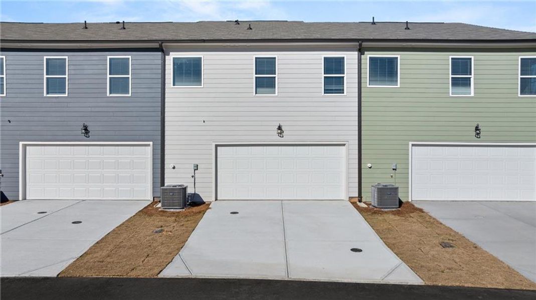 Front exterior of a new home in Lake Carlton, Loganville, GA, highlighting curb appeal (Image 18).