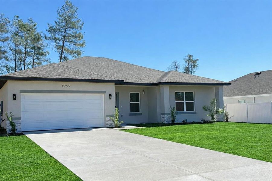 Front exterior of a new home in , Ocala, FL, highlighting curb appeal (Image 24).