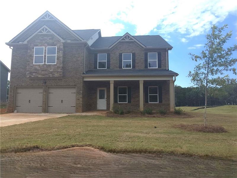Front exterior of a new home in Southern Hills, McDonough, GA, highlighting curb appeal (Image 19).