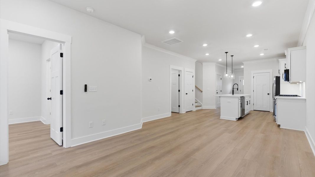Hardwood flooring and high standards define this vibrant family room ideal for everyday living at Pelham Crossing