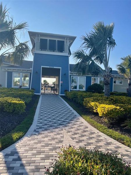 Front exterior of a new home in Bella Lago, Parrish, FL, highlighting curb appeal (Image 23).