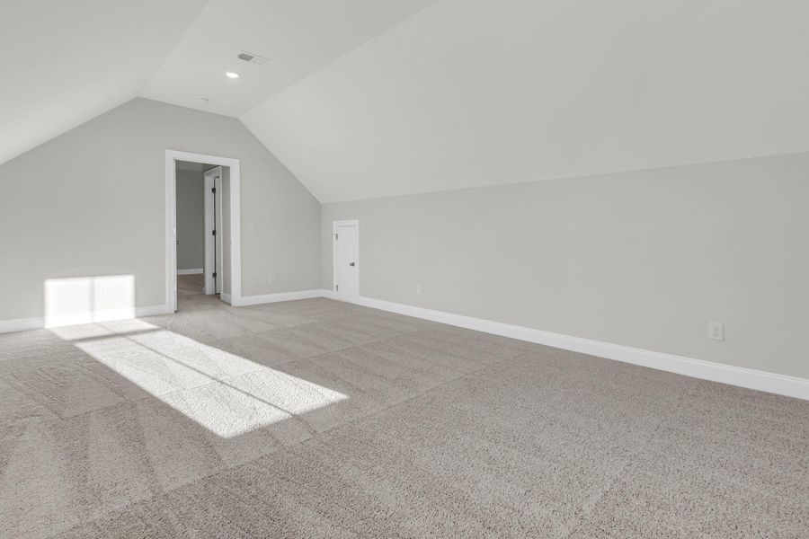 Spacious, unfurnished interior of a new home in Tidewater at Lakes of Cane Bay, Summerville (Image 31).