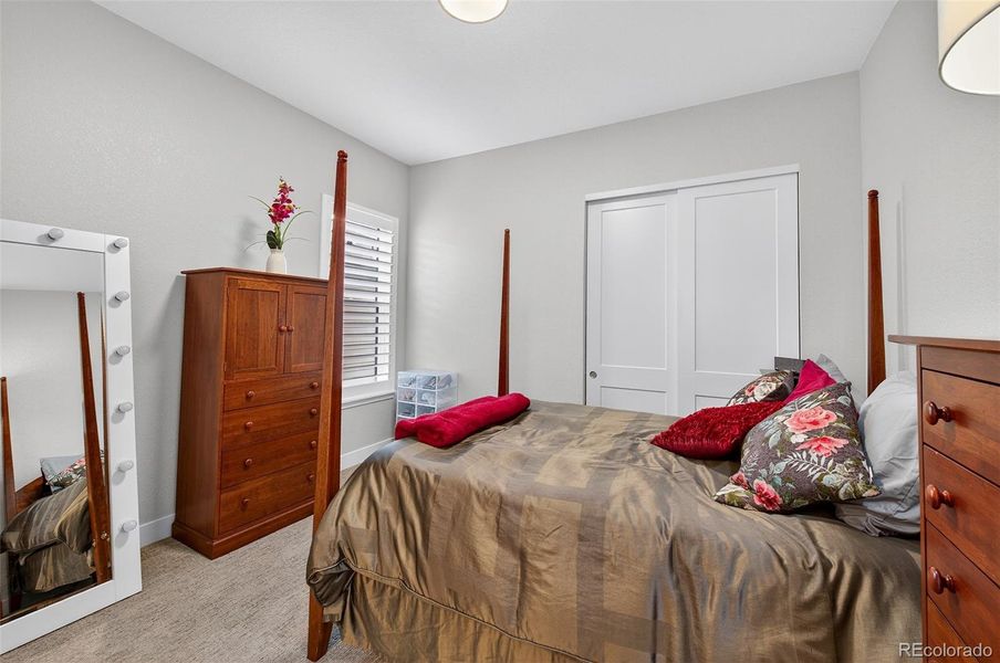 Bedroom 3 (Angle 2) – Comfortable space perfect for guests or flexible use, highlighted by soft neutral paint and coordinating wood furnishings.