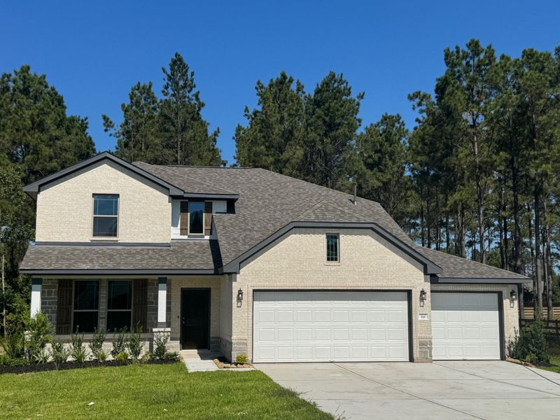 Front exterior of a new home in Deer Pines, Conroe, TX, highlighting curb appeal (Image 1). Front exterior of a new home in Deer Pines, Conroe, TX, highlighting curb appeal (Image 1).