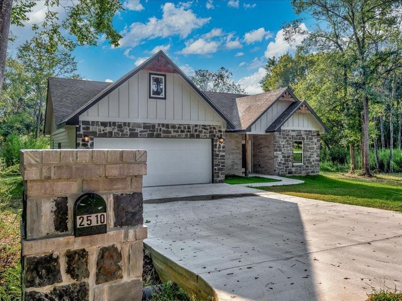 Front exterior of a new home in , Lufkin, TX, highlighting curb appeal (Image 2).