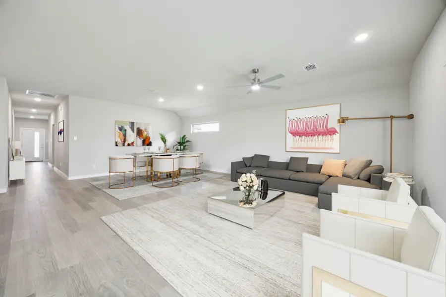 Dining and Living Room in the Hayden home plan by Trophy Signature Homes – REPRESENTATIVE PHOTO