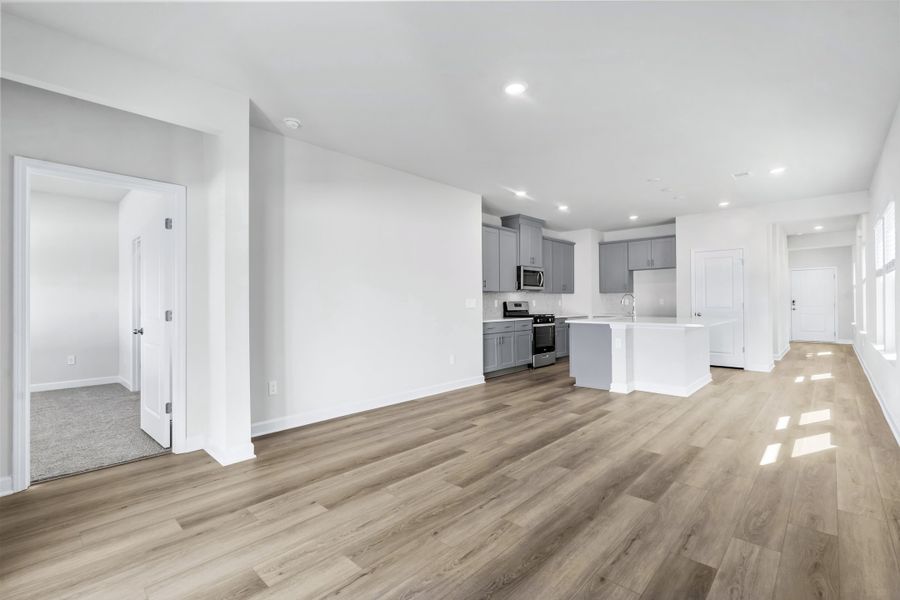 Spacious, unfurnished interior of a new home in Cypress Ridge - The Boardwalk Series, Longs (Image 15).