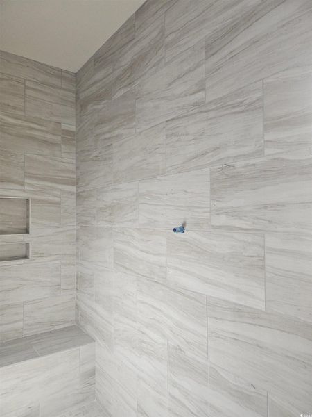 Deluxe tile shower being installed