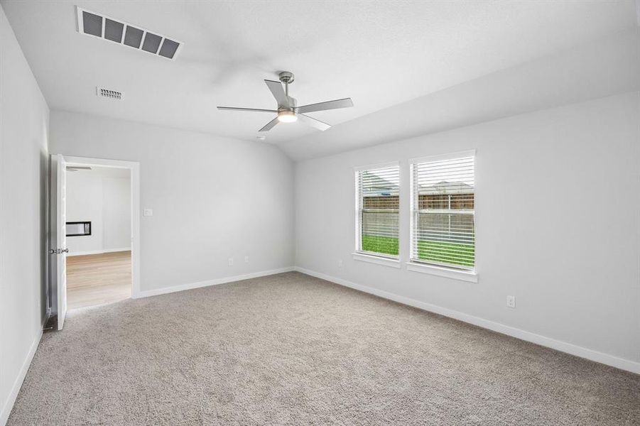 Primary Suite in the Oscar home plan by Trophy Signature Homes – REPRESENTATIVE PHOTO