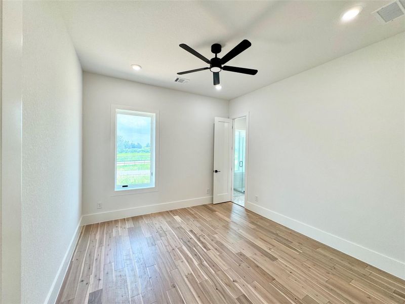 The third bedroom also features a Pella casement window and sleek ceiling fan with dimmable light as well as recessed led lighting. It has its own private bathroom as well.