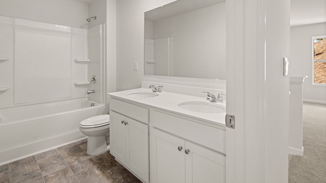 Representative furnished interior of a home built from the PENWELL by D.R. Horton in Palisades, Dallas (Image 36).