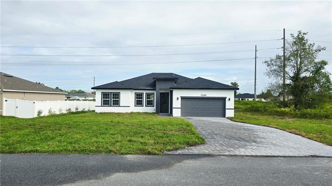 Front exterior of a new home in , Ocala, FL, highlighting curb appeal (Image 1).