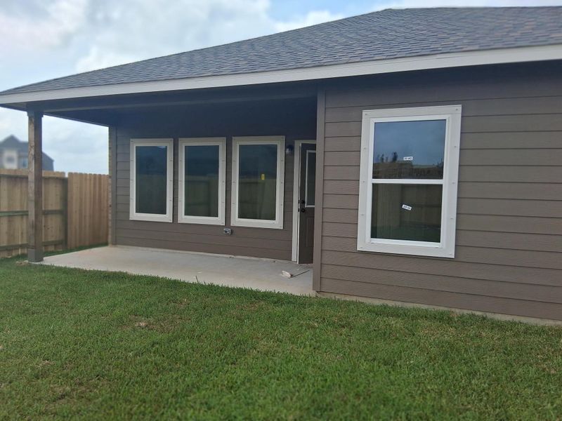Front exterior of a new home in Windrose Green, Angleton, TX, highlighting curb appeal (Image 15). Front exterior of a new home in Windrose Green, Angleton, TX, highlighting curb appeal (Image 15).