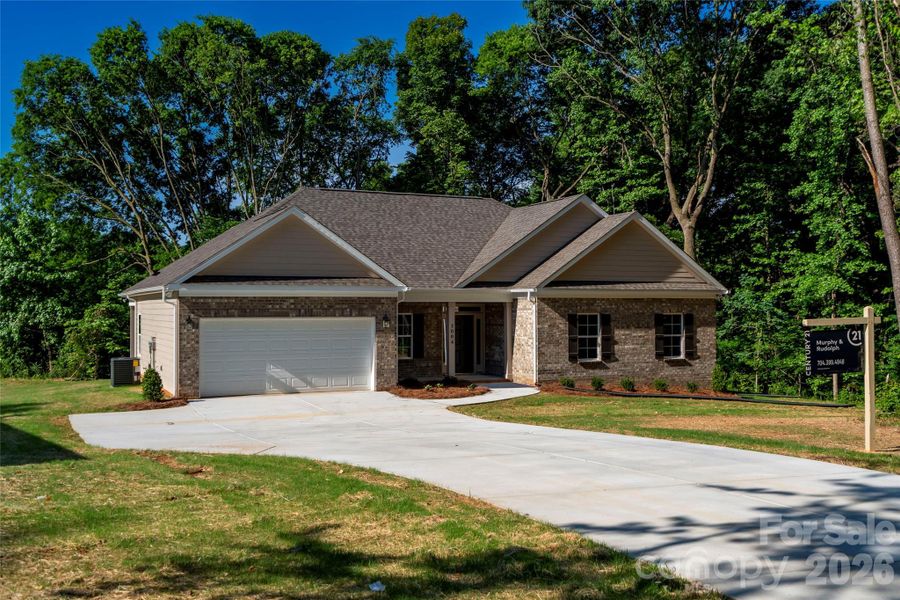 Front exterior of a new home in , Monroe, NC, highlighting curb appeal (Image 1). Front exterior of a new home in , Monroe, NC, highlighting curb appeal (Image 1).