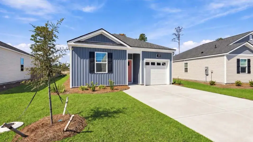Front exterior of a new home in The Lakes at North Glynn, Brunswick, GA, highlighting curb appeal (Image 17).
