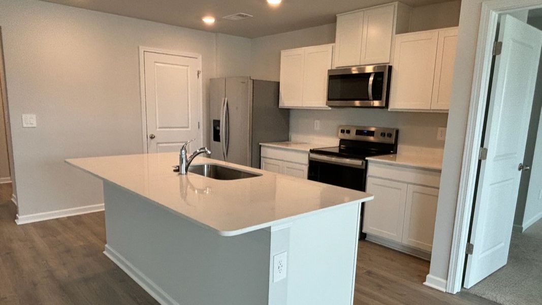 Furnished interior view inside a new home in The Parks, White House (Image 15).