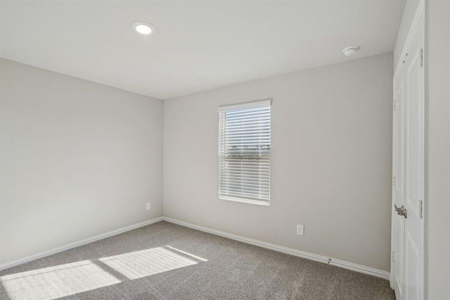 Empty room featuring carpet and recessed lighting