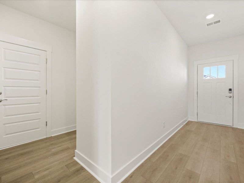 Spacious, unfurnished interior of a new home in The Coves at Lakes of Cane Bay II, Summerville (Image 29). Spacious, unfurnished interior of a new home in The Coves at Lakes of Cane Bay II, Summerville (Image 29).