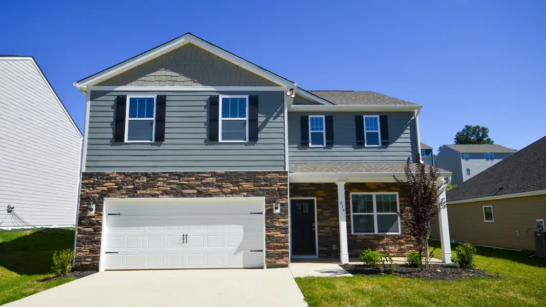 Front exterior of a new home in Rydele Heights, Asheville, NC, highlighting curb appeal (Image 1). Front exterior of a new home in Rydele Heights, Asheville, NC, highlighting curb appeal (Image 1).