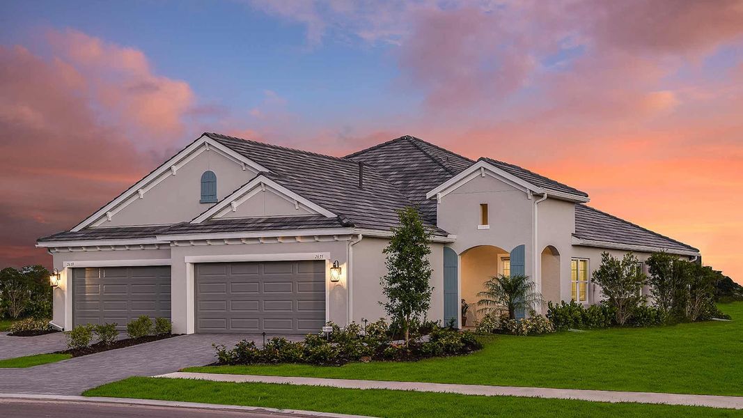 Front exterior of a new home in Windward, Lakewood Ranch, FL, highlighting curb appeal (Image 15). Front exterior of a new home in Windward, Lakewood Ranch, FL, highlighting curb appeal (Image 15).