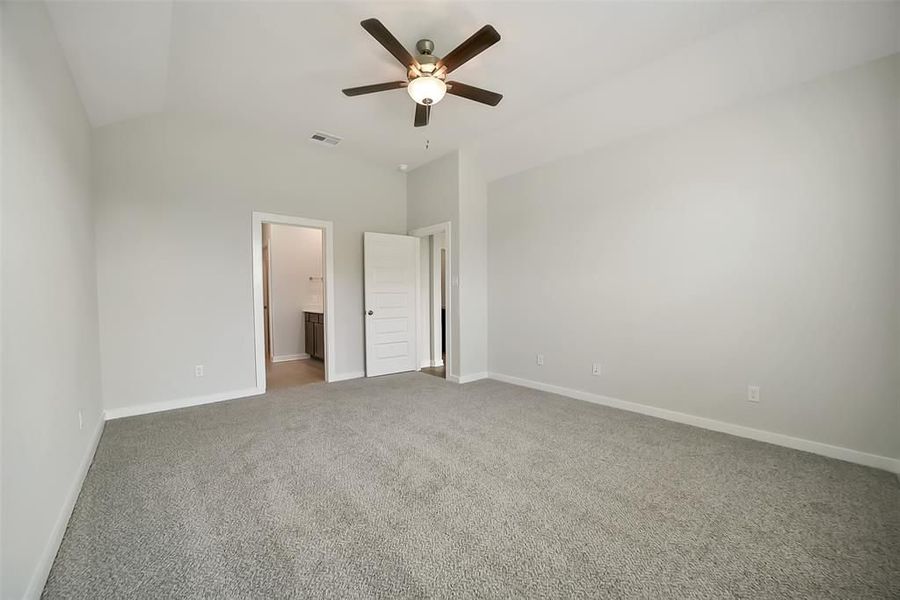 Spacious, unfurnished interior of a new home in Sunterra, Katy (Image 36).