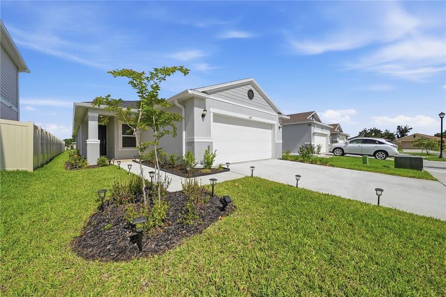 Front exterior of a new home in Magnolia Creek, Riverview, FL, highlighting curb appeal (Image 24). Front exterior of a new home in Magnolia Creek, Riverview, FL, highlighting curb appeal (Image 24).