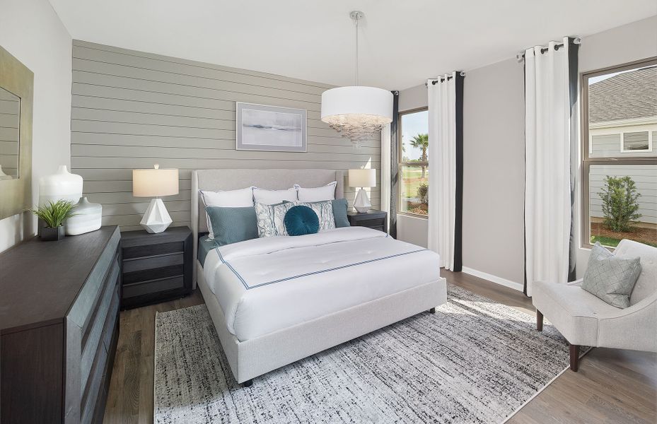 Owner's Suite with shiplap accent wall and windows Owner's Suite with shiplap accent wall and windows