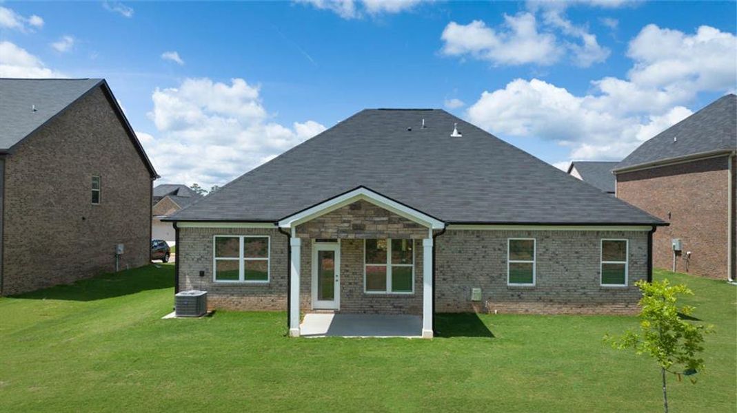 Exterior details and patio area of a home in Evergreen Crossing, Locust Grove (Image 4).