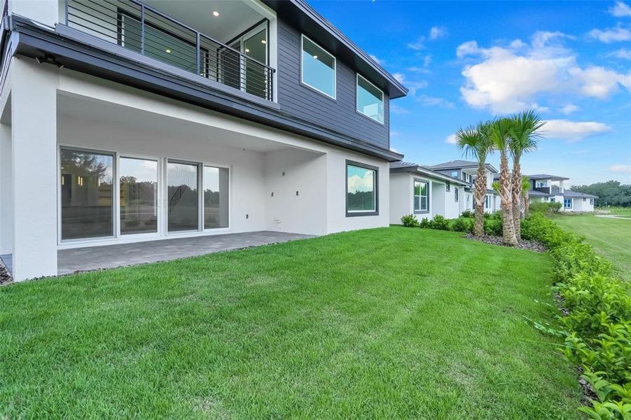 Exterior details and patio area of a home in Hampton Green at Providence, Davenport (Image 32).