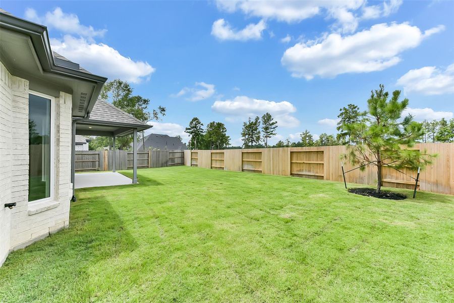 Front exterior of a new home in Evergreen 50', Conroe, TX, highlighting curb appeal (Image 2).