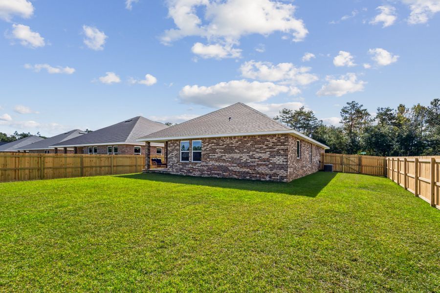 Representative exterior photo of a completed home built from the The Carlos by Herbst Homes in Doyle Hawkins Landing, Navarre, FL (Image 31).