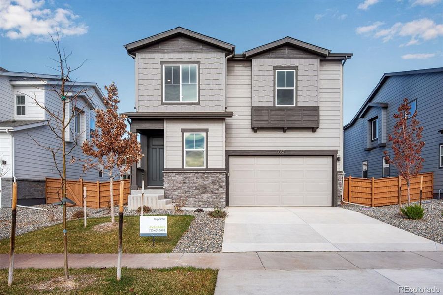 Front exterior of a new home in Medley at Reunion Ridge, Commerce City, CO, highlighting curb appeal (Image 26).
