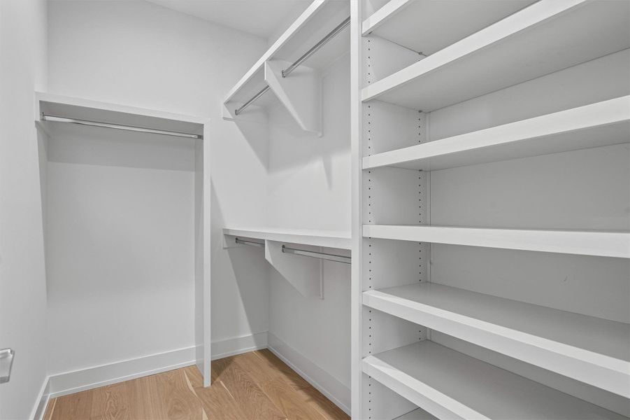 The primary closet features built-ins to make for easy organization. The primary closet features built-ins to make for easy organization.