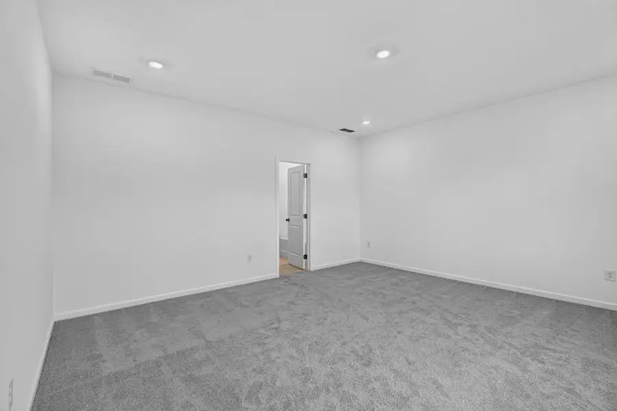 Spacious, unfurnished interior of a new home in Weatherfield, Buford (Image 19).
