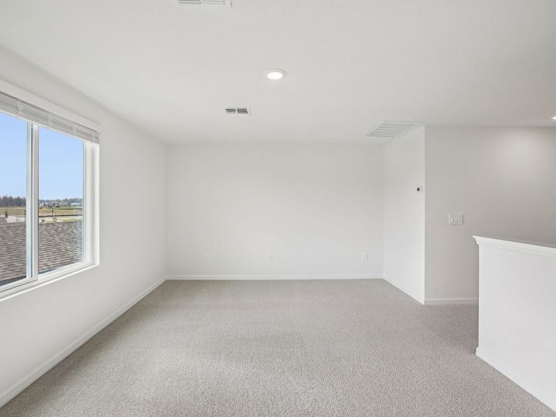 Spacious, unfurnished interior of a new home in The Grove at Stuart Crossing - Classic Series, Bartow (Image 14).