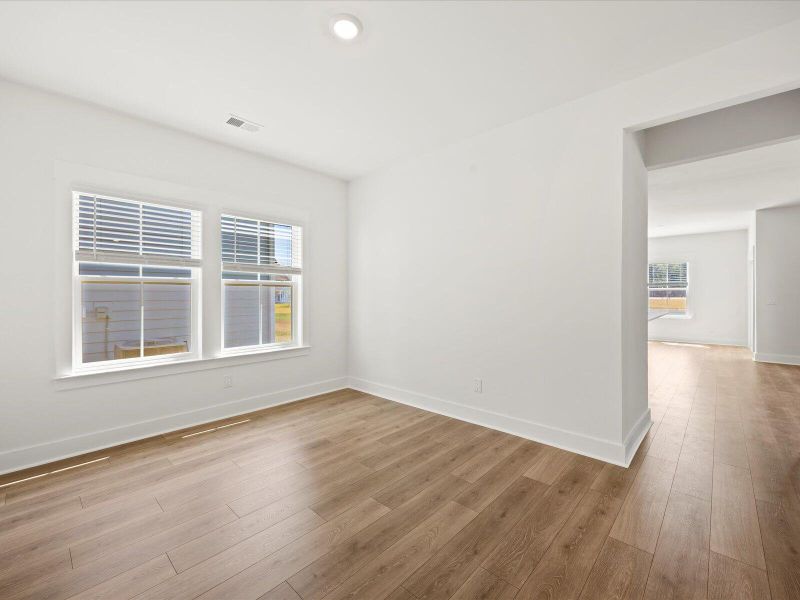 Spacious, unfurnished interior of a new home in The Coves at Lakes of Cane Bay II, Summerville (Image 14).