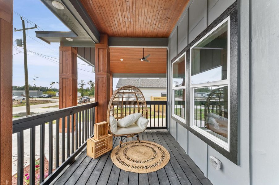 Large covered front porch with wood accents and LED lighting. Large covered front porch with wood accents and LED lighting.