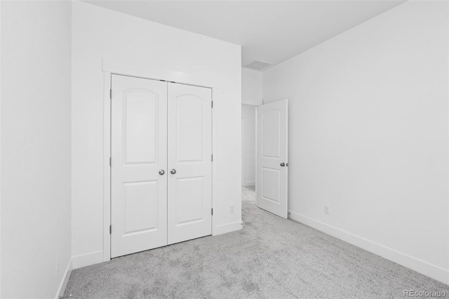 Spacious, unfurnished interior of a new home in Painted Prairie Cottage, Aurora (Image 24).