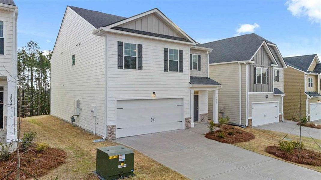 Front exterior of a new home in Shoal Creek, Hampton, GA, highlighting curb appeal (Image 20).