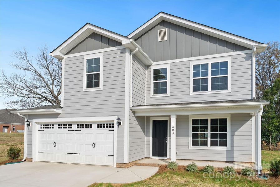 Front exterior of a new home in , Monroe, NC, highlighting curb appeal (Image 24).