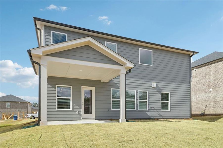 Exterior details and patio area of a home in Creekside at Oxford Park, Fairburn (Image 30).