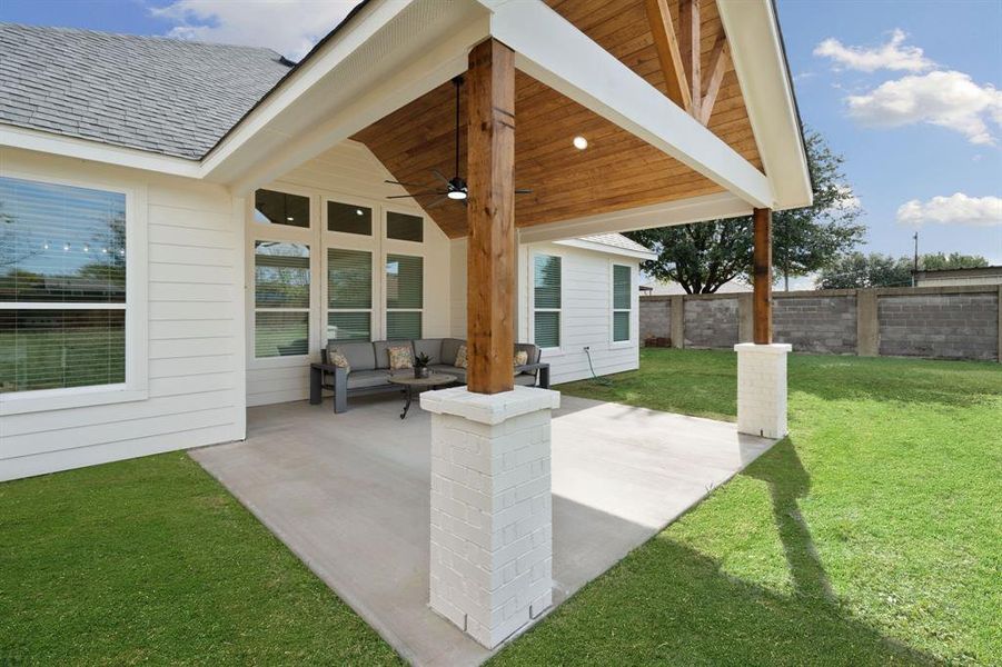 View of patio with outdoor lounge area and a ceiling fan View of patio with outdoor lounge area and a ceiling fan